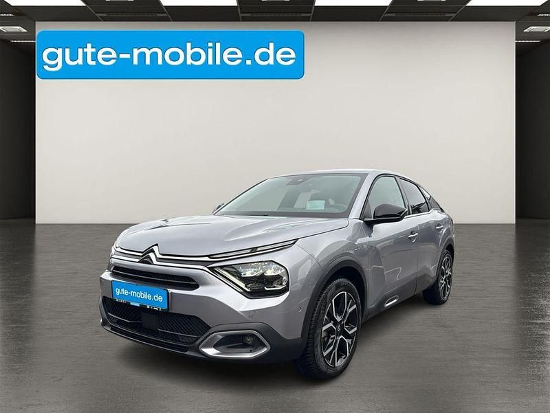 Grau Gebraucht 2024 Citroën e-C4 Shine Limousine | 22.990 € (Fairer Preis) - Bild 1/4