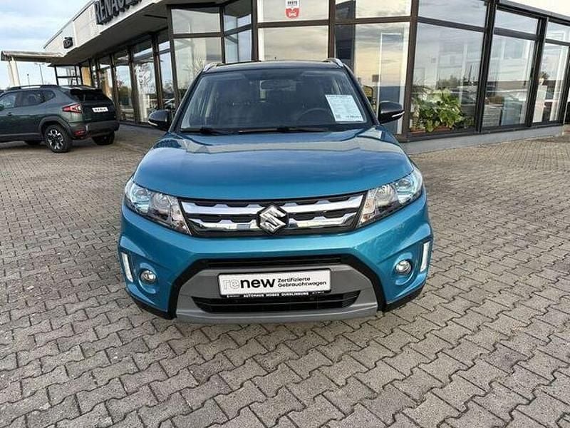 Grün Gebraucht 2016 Suzuki Vitara Comfort+ SUV | 13.990 € (Fairer Preis) - Bild 1/4