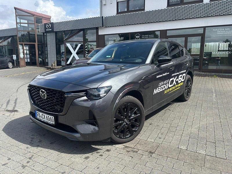 Grau Gebraucht 2025 Mazda CX-60 Homura-Line SUV | 53.790 € (Fairer Preis) - Bild 1/4