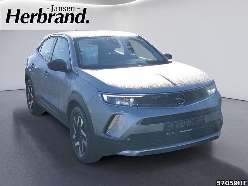Gebraucht Opel Mokka-e Elegance 100 kW (136 PS) 2022 Kontrast grau/quarz silber SUV