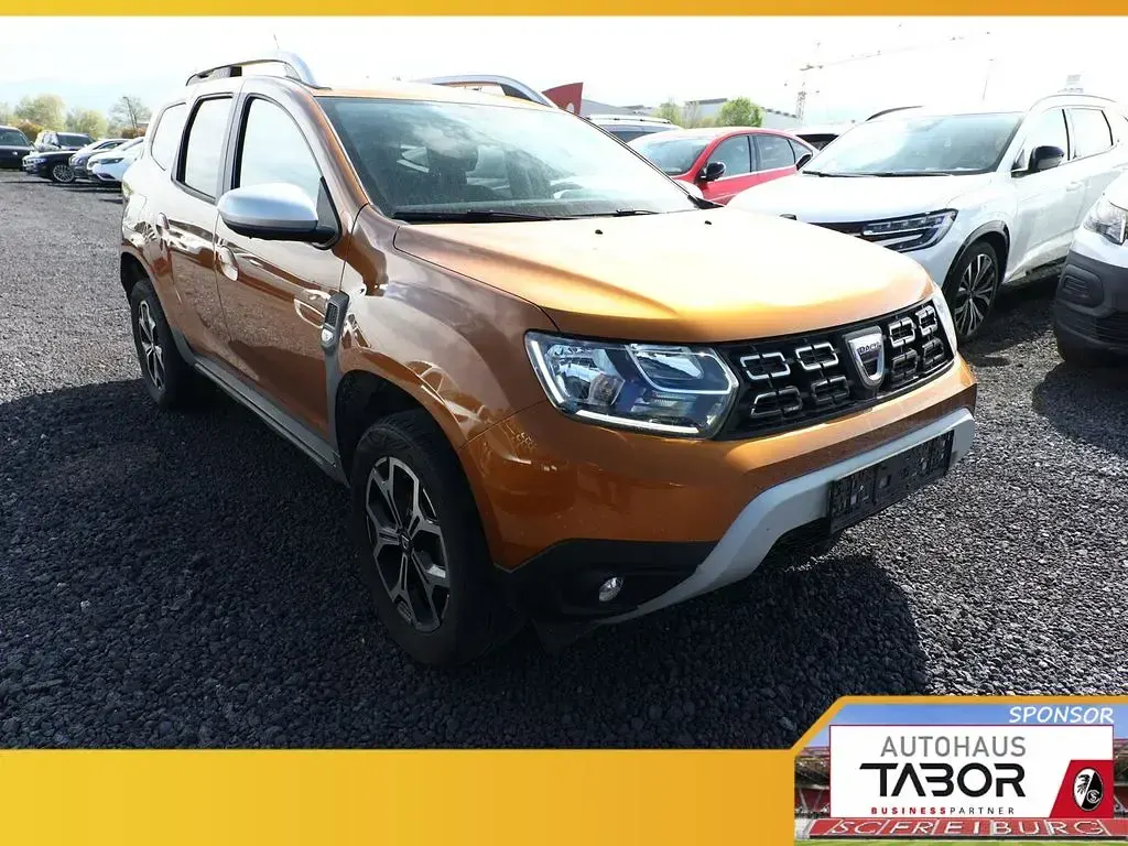 Używany Dacia Duster Prestige 101 KM (74 kW) 2021 Pomarańczowy SUV