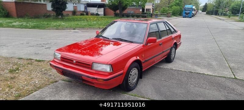 Rot Gebraucht 1990 Nissan Bluebird Limousine | 2.490 € - Bild 1/4