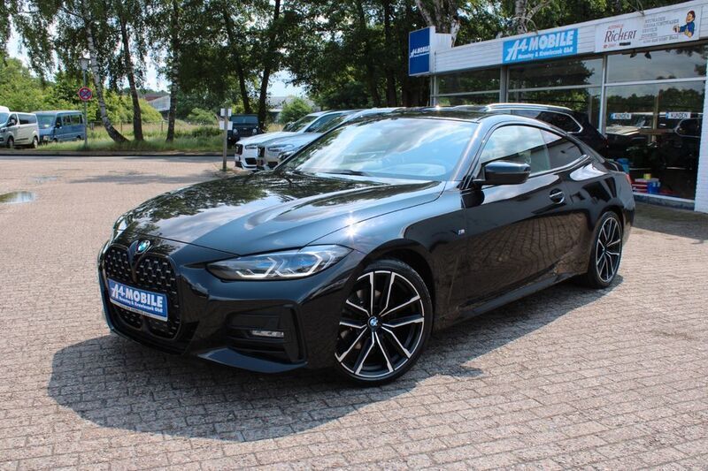 Black sapphire metallic (metallic) Gebraucht 2020 BMW 420 Sport Line Coupé | 32.499 € - Bild 1/4