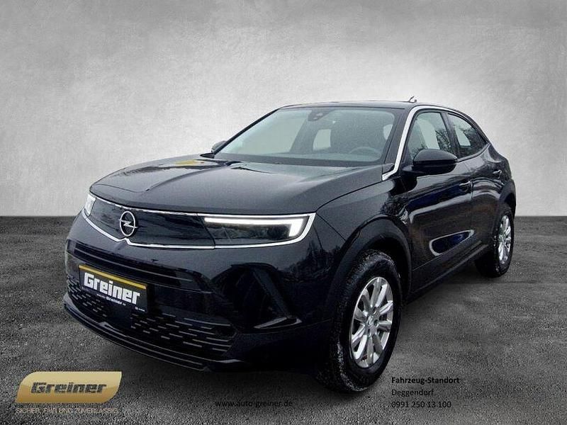 Karbon schwarz (metallic) Gebraucht 2024 Opel Mokka Enjoy SUV | 18.990 € (Fairer Preis) - Bild 1/4