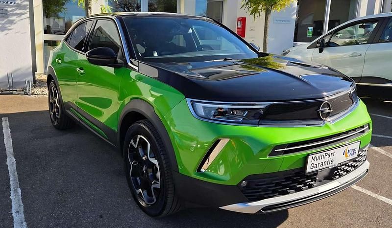 Grün Gebraucht 2021 Opel Mokka-e Ultimate SUV | 16.480 € (Fairer Preis) - Bild 1/4