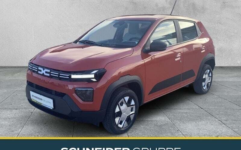 Brick red Neu 2025 Dacia Spring Expression Kleinwagen | 15.780 € (Fairer Preis) - Bild 1/4
