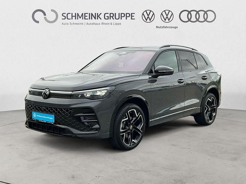 Delfingrau metallic Gebraucht 2024 VW Tiguan R-line SUV | 53.880 € - Bild 1/4