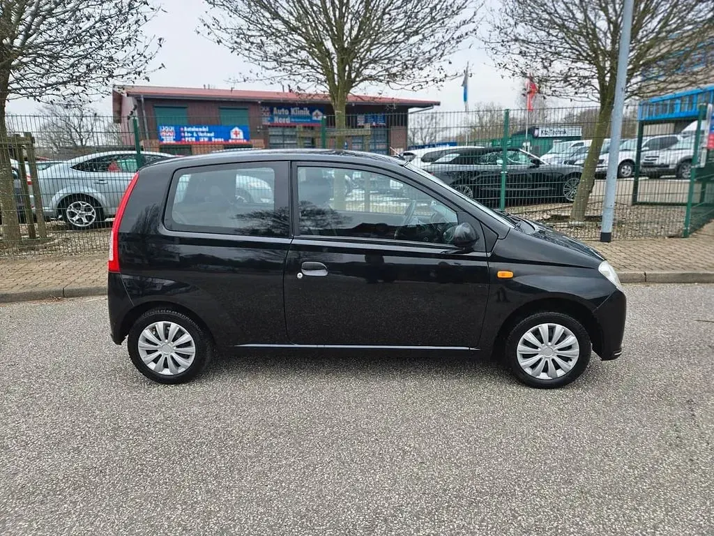Gebraucht Daihatsu Cuore Plus 58 PS (42 kW) 2006 Schwarz Kleinwagen