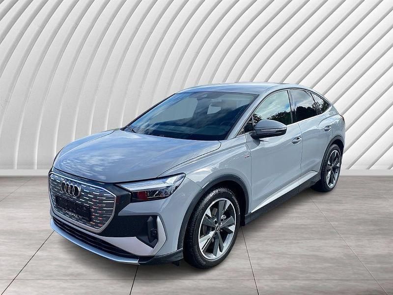 Grau Gebraucht 2022 Audi Q4 Sportback e-tron Sport SUV | 26.490 € (Guter Preis) - Bild 1/4