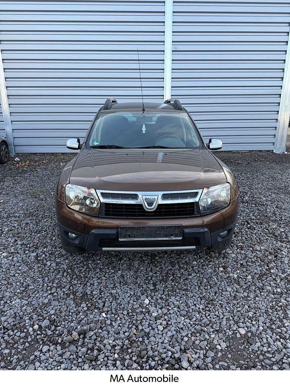Braun Gebraucht 2013 Dacia Duster Ambiance SUV | 3.600 € - Bild 1/4