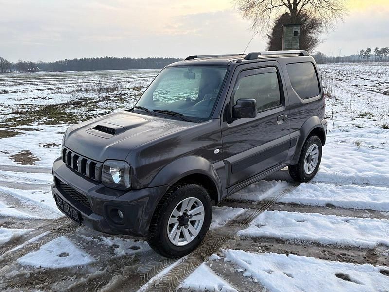 Grau Gebraucht 2013 Suzuki Jimny SUV | 13.900 € (Fairer Preis) - Bild 1/4