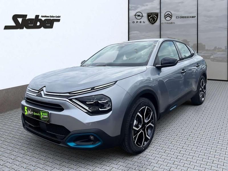 Platinum grau Gebraucht 2023 Citroën e-C4 Feel Limousine | 20.990 € (Fairer Preis) - Bild 1/4