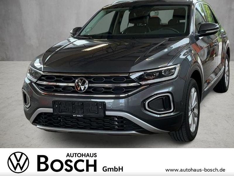Indiumgrau Gebraucht 2024 VW T-Roc Style SUV | 27.350 € (Guter Preis) - Bild 1/4