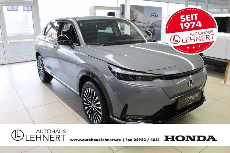 Grau Neu 2025 Honda e:Ny1 Advance SUV | 37.990 € (Fairer Preis) - Bild 1/4