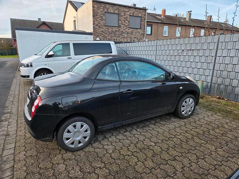 Schwarz Gebraucht 2006 Nissan Micra C+C Cabrio | 1.950 € - Bild 1/4