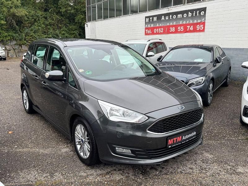 Grau Gebraucht 2016 Ford Grand C-Max Business Edition Van / Kleinbus | 7.990 € (Fairer Preis) - Bild 1/4