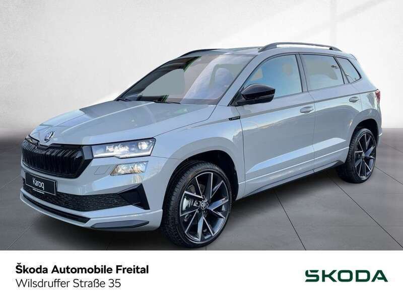 Stahlgrau Gebraucht 2024 Skoda Karoq SportLine SUV | 39.980 € - Bild 1/4