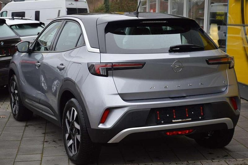 Gebraucht Opel Mokka-e Elegance 100 kW (136 PS) 2022 Kontrast grauquarz silber (metallic) SUV