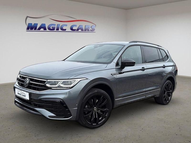 Platinum grey (metallic) Gebraucht 2023 VW Tiguan Allspace R-line SUV | 38.900 € (Guter Preis) - Bild 1/4
