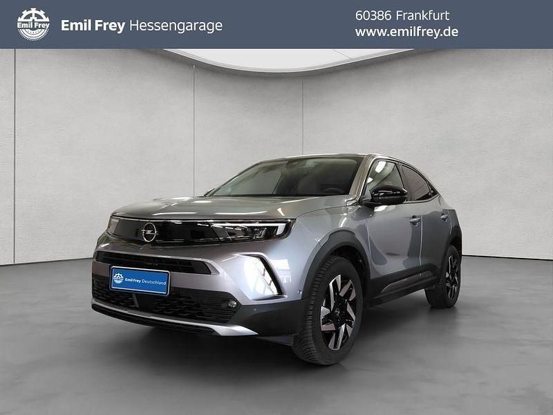 Kontrast grau metallic Gebraucht 2022 Opel Mokka Elegance SUV | 22.550 € (Fairer Preis) - Bild 1/4