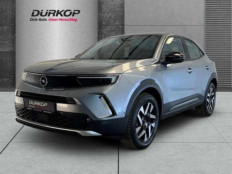 Gebraucht Opel Mokka-e Elegance 100 kW (136 PS) 2023 Kontrast grau/quarz silber SUV