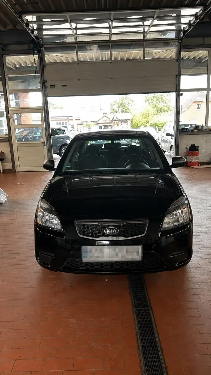 Gebraucht Kia Rio 95 PS (69 kW) 2010 Schwarz Kleinwagen
