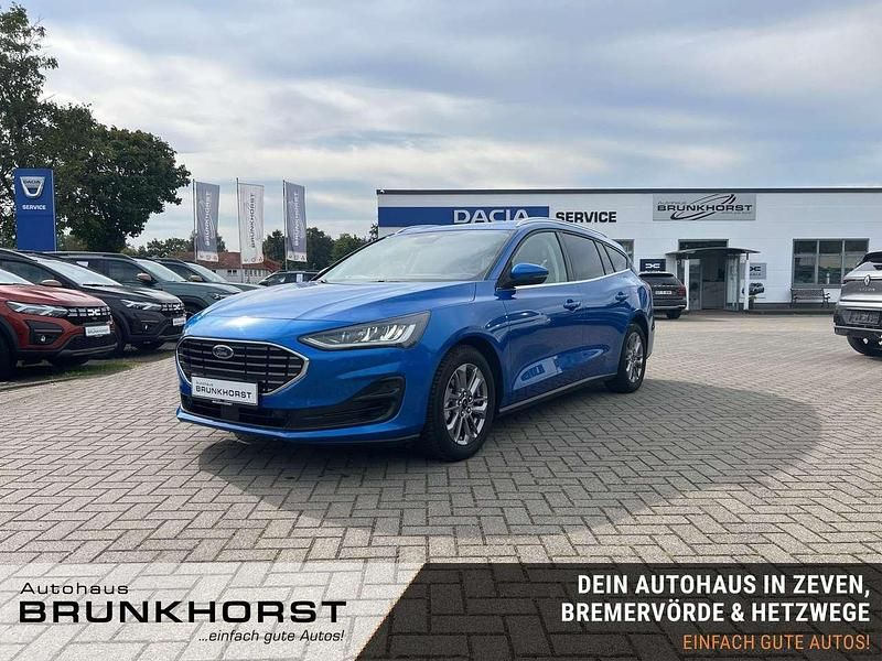 Blau (desert island blue) Gebraucht 2024 Ford Focus Titanium X Kombi | 22.990 € (Guter Preis) - Bild 1/3