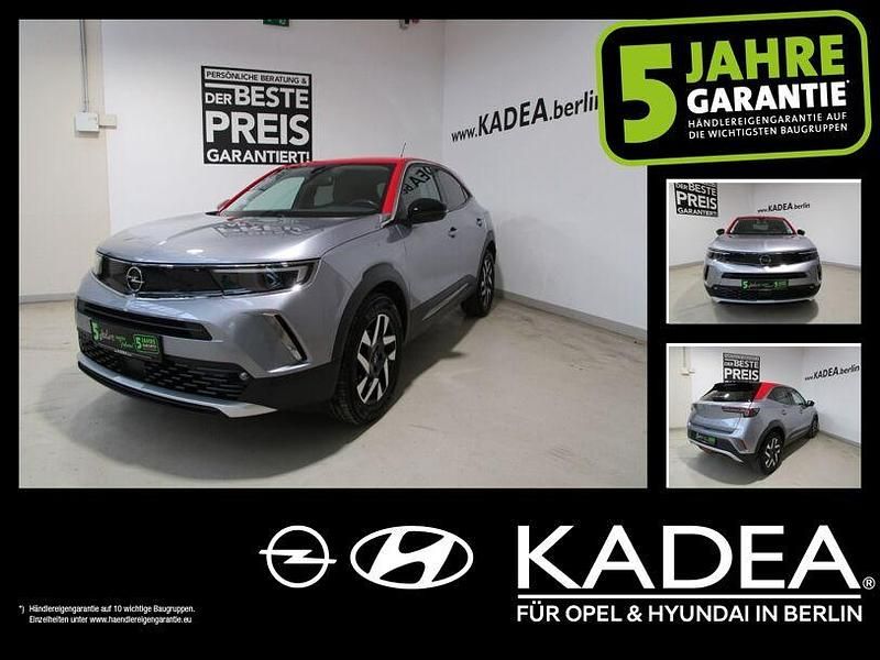 Kontrast grau/quarz silber (metallic) Gebraucht 2021 Opel Mokka SUV | 16.990 € (Guter Preis) - Bild 1/4