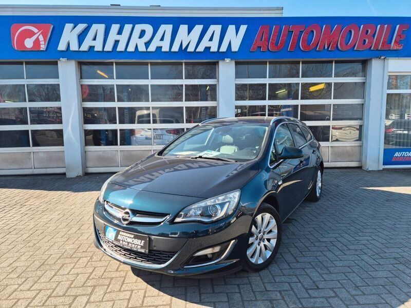 Grün Gebraucht 2014 Opel Astra Exklusiv Kombi | 7.699 € (Fairer Preis) - Bild 1/4