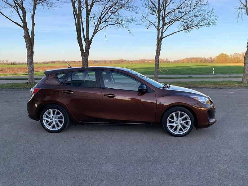 Gebraucht Mazda 3 Prime-Line 105 PS (77 kW) 2012 Autumn bronze mica Limousine