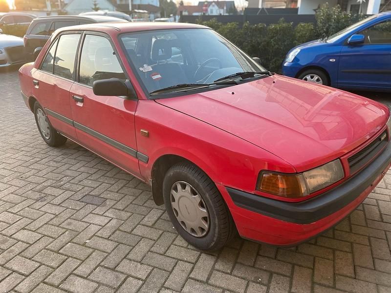 Gebraucht Mazda 323 88 PS (64 kW) 1991 Rot Limousine