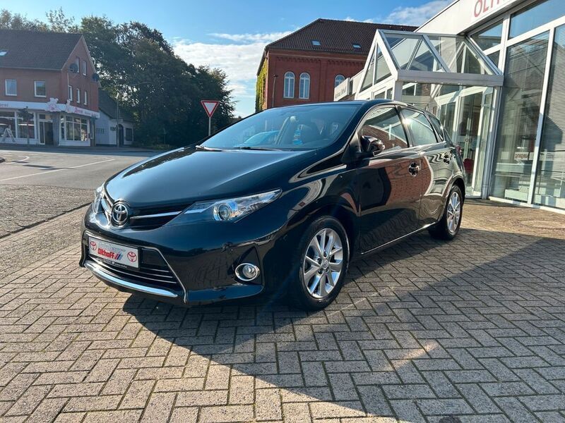 Black mica / ink Gebraucht 2013 Toyota Auris Executive Limousine | 10.580 € (Fairer Preis) - Bild 1/4