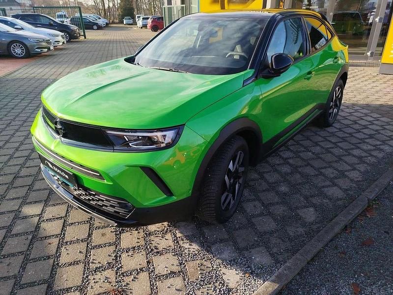 Gebraucht Opel Mokka 131 PS (96 kW) 2024 Lackierung matcha green/typ aussenverkleidung metalliclackierung SUV