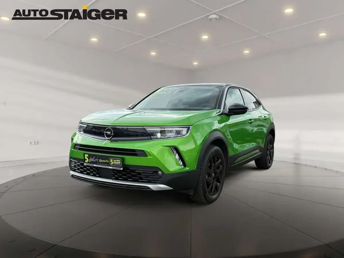Gebraucht Opel Mokka-e Elegance 100 kW (136 PS) 2022 Matcha green/ikone gruen SUV