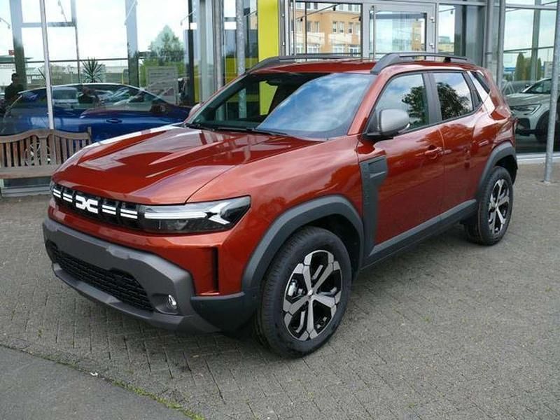 Braun Neu 2025 Dacia Duster Journey SUV | 26.621 € (Fairer Preis) - Bild 1/3