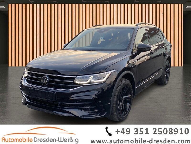 Schwarz deep black perleffekt (metallic) Gebraucht 2024 VW Tiguan Allspace R-line SUV | 43.980 € (Fairer Preis) - Bild 1/3