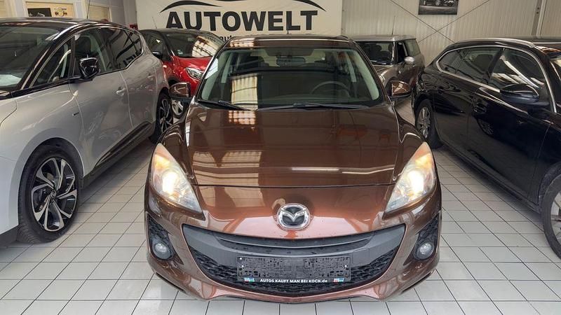 Używany Mazda 3 Edition 105 KM (77 kW) 2012 Brązowy Sedan/Limuzyna