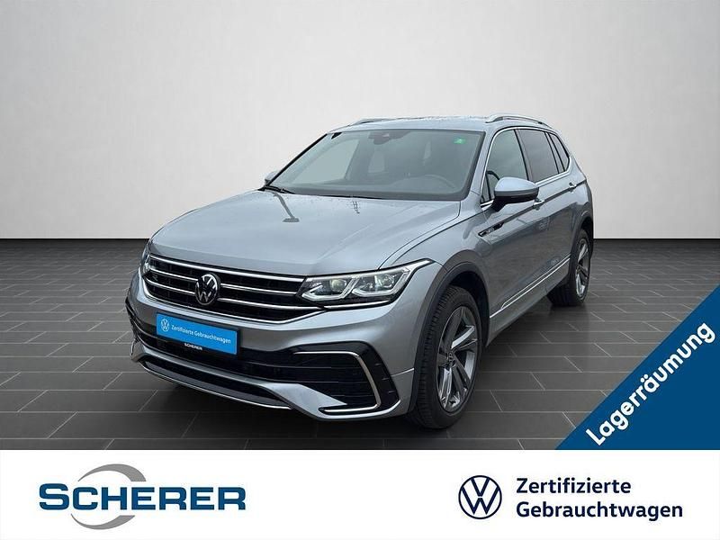 Pyritsilber metallic Gebraucht 2024 VW Tiguan Allspace R-line SUV | 38.600 € (Guter Preis) - Bild 1/4
