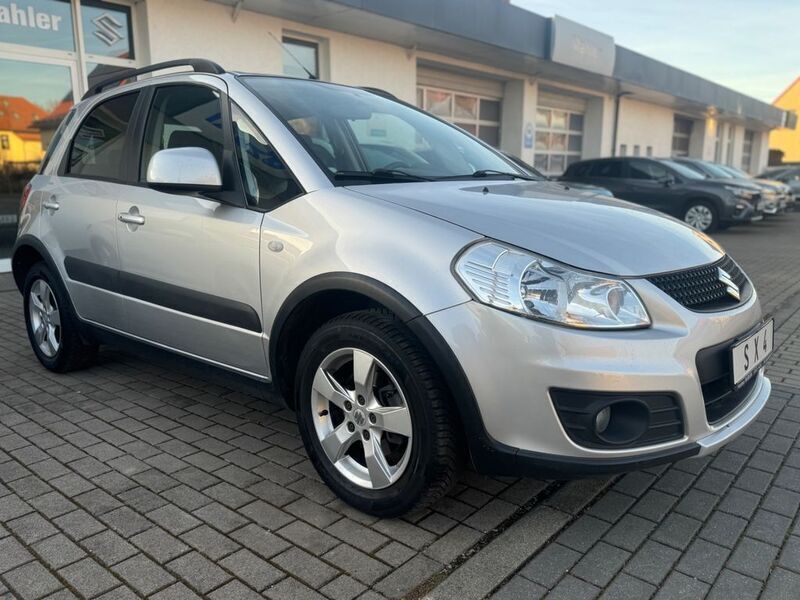 Silber Gebraucht 2013 Suzuki SX4 Comfort Limousine | 8.850 € (Fairer Preis) - Bild 1/4