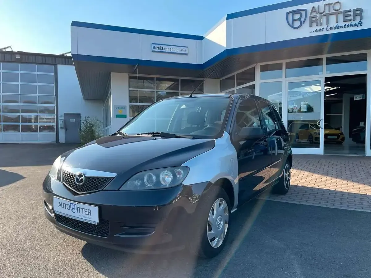 Używany Mazda 2 Comfort 75 KM (55 kW) 2006 Niebieski Hatchback