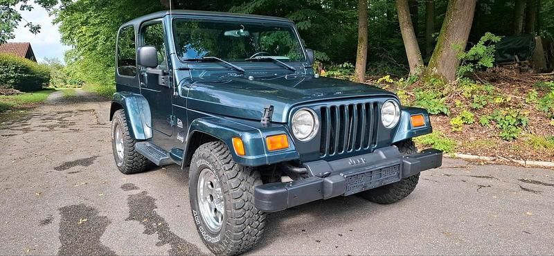 Andere außenfarben Gebraucht 2005 Jeep Wrangler Sahara SUV | 20.500 € (Fairer Preis) - Bild 1/4