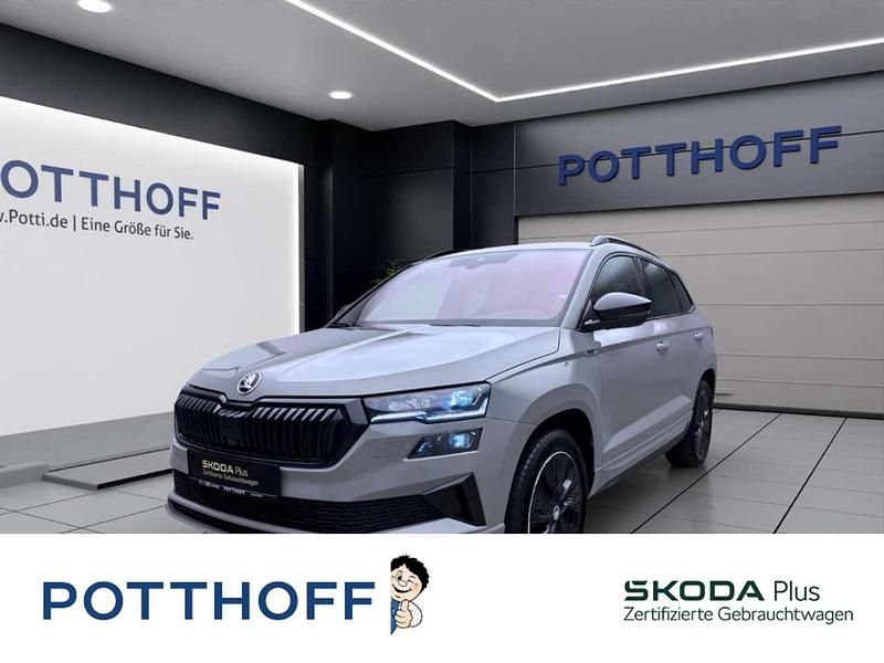 Grau Gebraucht 2024 Skoda Karoq SportLine SUV | 34.777 € (Guter Preis) - Bild 1/4