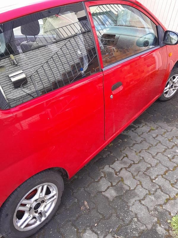 Gebraucht Daihatsu Cuore 58 PS (42 kW) 2006 Rot Kleinwagen
