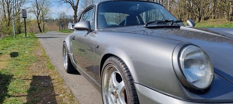 Silber Gebraucht 1989 Porsche 911 Carrera Coupé | 99.999 € - Bild 1/4
