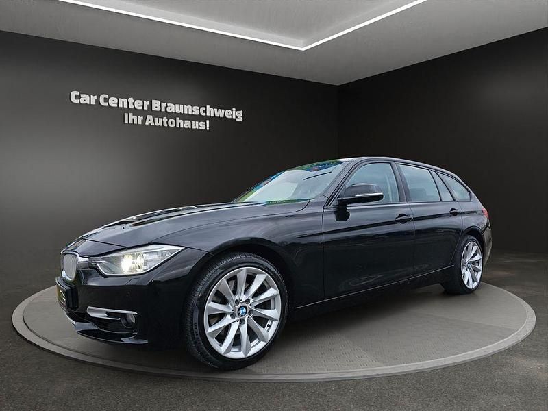 Schwarz Gebraucht 2012 BMW 330 Sport Line Kombi | 11.999 € (Fairer Preis) - Bild 1/4