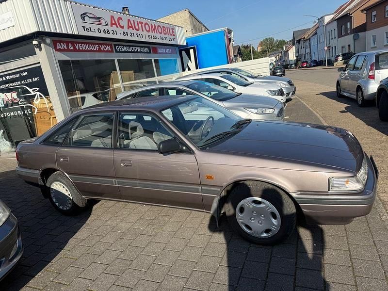 Braun Gebraucht 1990 Mazda 626 Limousine | 2.999 € - Bild 1/4