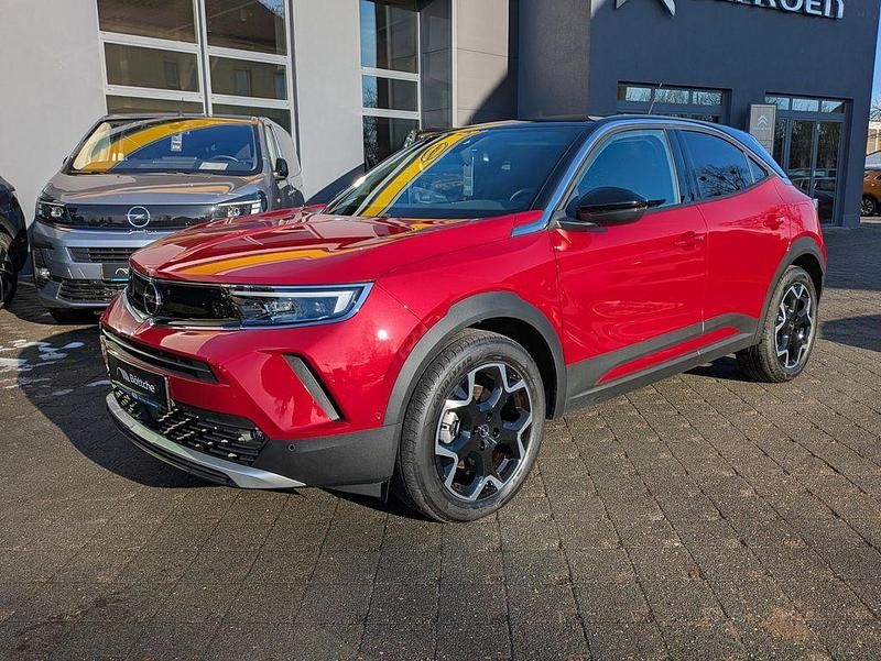 Gebraucht Opel Mokka-e Ultimate 100 kW (136 PS) 2024 Lackierung rot rubi/typ aussen SUV