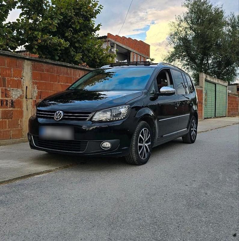 Schwarz Gebraucht 2012 VW Touran Highline Van / Kleinbus | 8.399 € (Teuer) - Bild 1/4