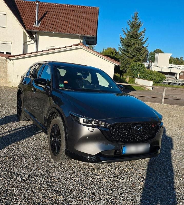 Grau Gebraucht 2023 Mazda CX-5 Takumi-Line SUV | 32.499 € (Superpreis) - Bild 1/4