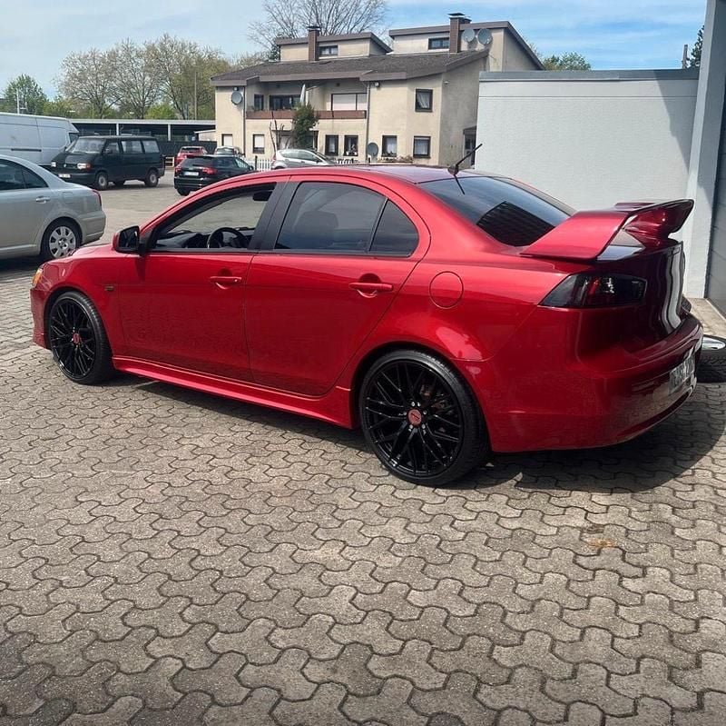 Rot Gebraucht 2009 Mitsubishi Lancer Limousine | 6.300 € (Fairer Preis) - Bild 1/4